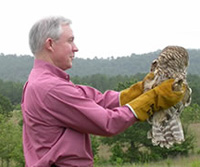 Senator Sessions releases an owl back into the wild at the Mountain Longleaf National Wildlife Refuge at McClellan.