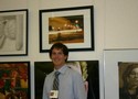 Ian in front of his winning art work, a digital photograph titled 