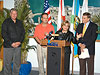 Congresswoman Ileana Ros-Lehtinen hosts press conference at the Port of Miami with her Floridian colleague Rep. John Mica (right), Port Director Bill Johnson (left), and County Manager George Burgess (center), to discuss phase III dredging, port security, and to tour the cruise and cargo facilities.