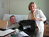 Congresswoman Ileana Ros-Lehtinen met with wounded US soldiers recuperating at an airbase in Germany. Ros-Lehtinen was en route back to the US after visiting Darfur, Sudan, and Egypt. Here we see the Congresswoman presenting UM gear to one of our wounded soldiers