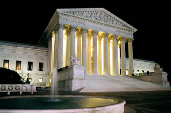 The Supreme Court Building at night with fountain