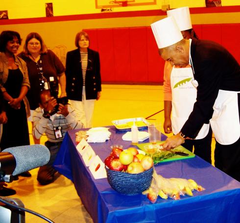 Congressman Clay whips up a healthy snack for Cote Brilliante students at his Let's Move/Healthy Eating Event