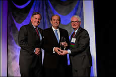 Congressman Costello receives the RCGA's Right Arm of St. Louis Award from RCGA Chairman-Elect Danny Ludeman (left) and RCGA Chairman Tom Voss (right).