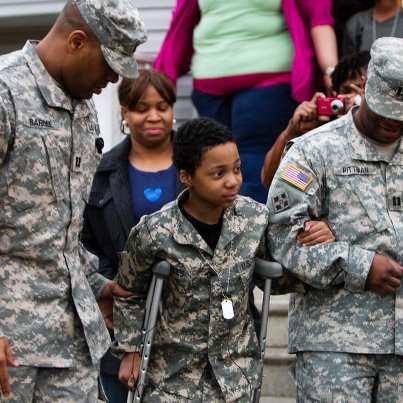 Photo: U.S. Army Reserve captains John Barbee and Sherman Pittman assist Khalil Quarles, 10, down the sidewalk outside his home during a surprise visit from members of the 200th Military Police Command and the Office of the Chief, Army Reserve. Quarles, who is terminally ill, said it would be his dream to enlist in the Army. More than two-dozen Soldiers assigned to the 200th MPCOM and the Office of the Chief, Army Reserve stood shoulder-to-shoulder during an enlistment ceremony for Quarles Dec. 19. Read more about the ceremony from DVIDSHUB: http://www.dvidshub.net/news/99592/soldiers-help-boy-live-military-dream#.UNNQa-TIW3m