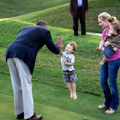 Photo: High five: President Obama greeting a child in Williamsburg, Virginia.