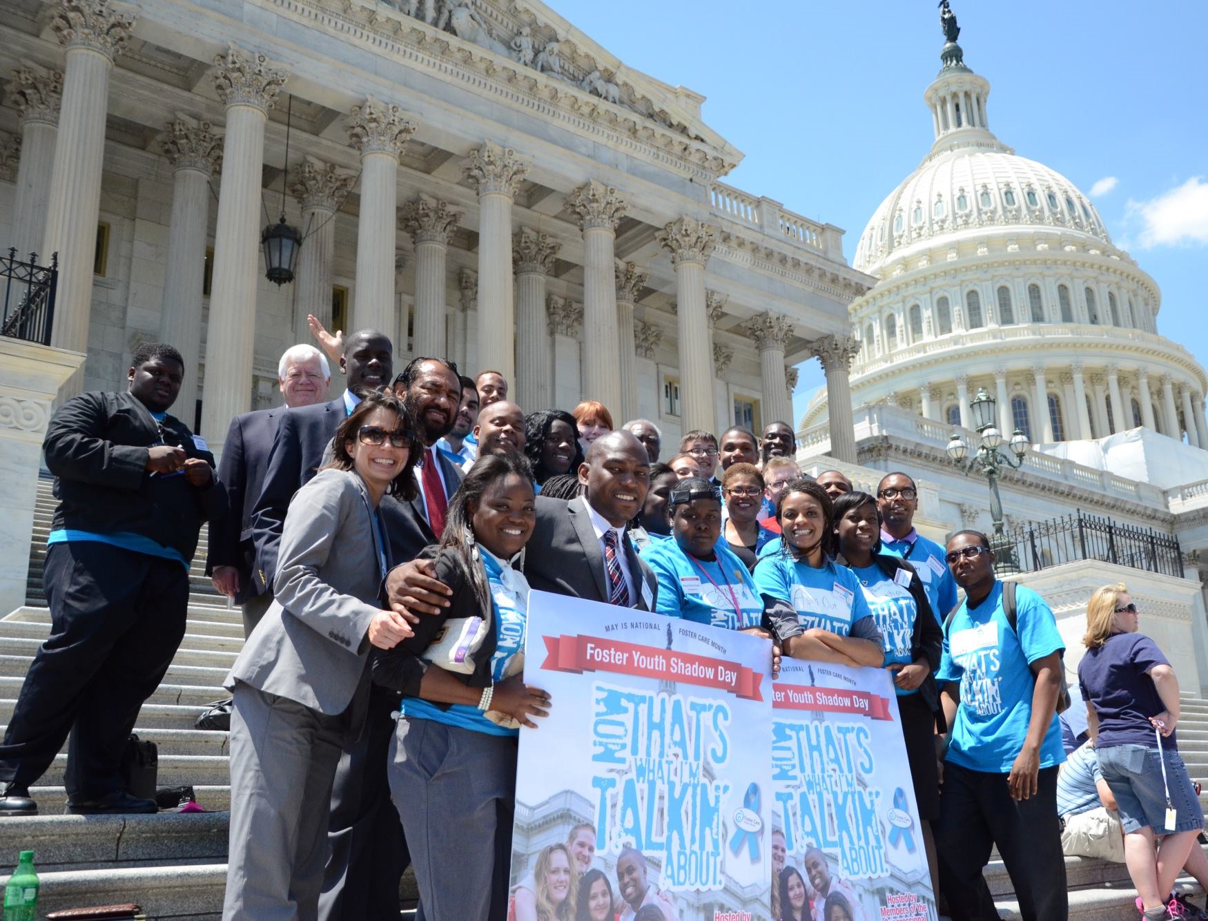 Former foster youth stand with Congressmember Bass and members of Congress on the first Foster Youth Shadow Day