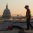 Work Photography of a Worker repairing the Hart Roof at sunset.