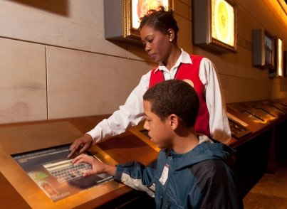A Visitor Guide helps a child at the Capitol Visitor Center