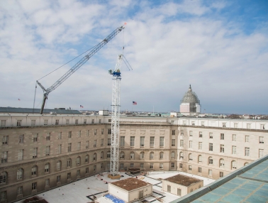 Tower crane being installed at the Cannon House Office Building.