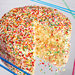 A homemade Sprinkle Cake using the recipe from Sprinkles, Candace Nelson’s bakery chain. The cake has become a signature item with sprinkles inside and out.