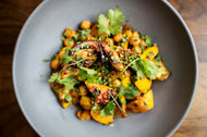 Grilled octopus with chickpeas, summer squash and coriander.
