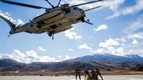 A CH-53E Super Stallion, with Marine Heavy Helicopter Squadron 466, hovers to pick up a 500-gallon drum of water from U.S. Marines with Combat Logistics Battalion 15, 1st Marine Logistics Group and 3rd Battalion, 4th Marine Regiment, 1st Marine Division during a Helicopter Support Team drill at Mountain Warfare Training Center, Bridgeport, California, Oct. 25, 2016. The drum was taken into the Sierra Mesa Mountains to support Marines who are conducting field operations during Mountain Exercise 6-16. 