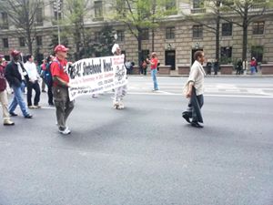 'Walking in the Emancipation Day Parade with D.C. residents last week. On the banner behind me, 'FREE DC! Statehood Now!' Need I say more?'