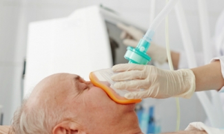 Male patient with sedation mask