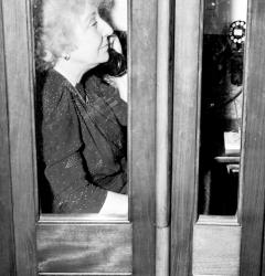 In a Capitol phone booth, Jeannette Rankin calls for assistance following her vote against war on December 8, 1941.