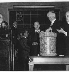 Selective service, or the draft, used a lottery to call up men for military duty. Here, President Franklin D. Roosevelt watches Navy Secretary Frank Knox draw a number.