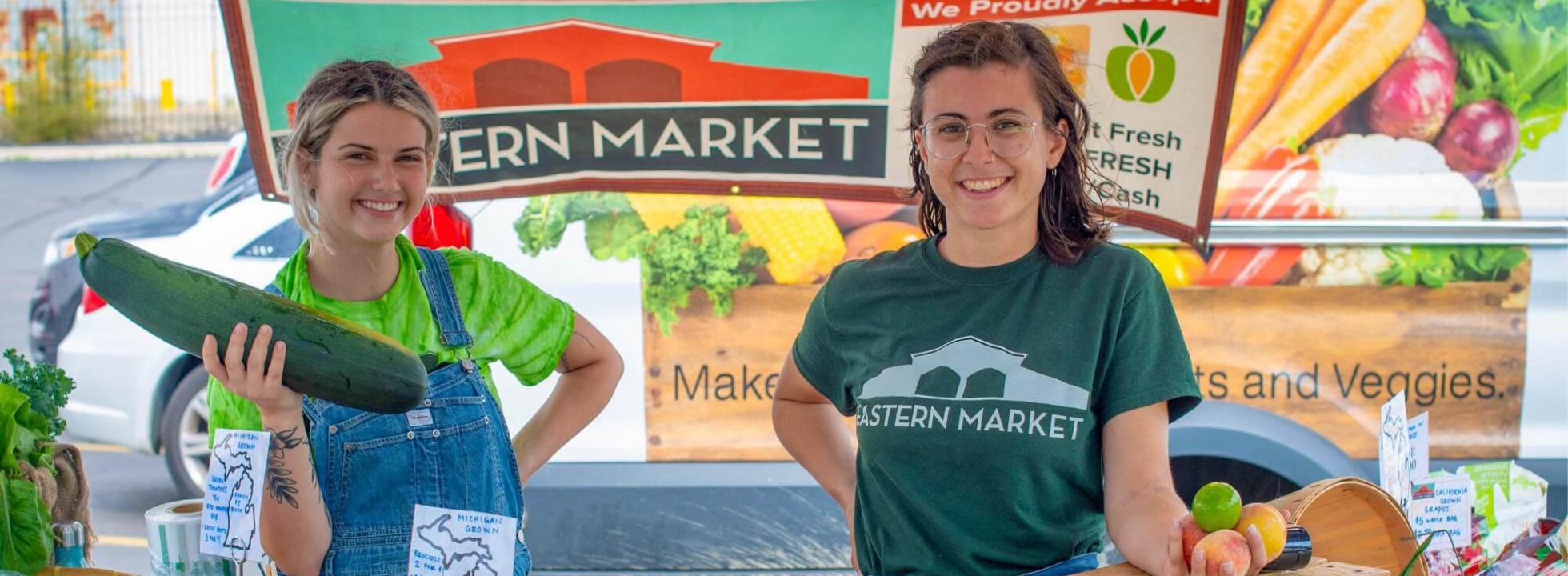 Two young farmers at a farmers market.