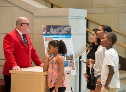 A guide welcomes visitors to the Capitol Visitor Center for 2016 Preservation Day.
