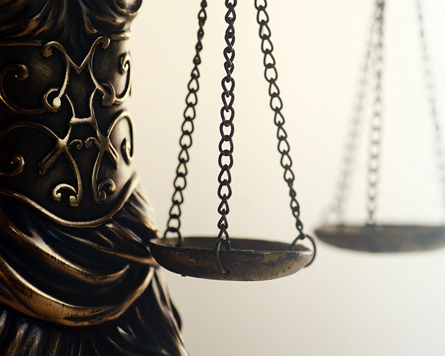 Close-up of a fancy bronze scale representing justice