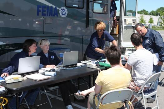 FEMA staff assisting survivors at a Mobile Disaster Recovery Center