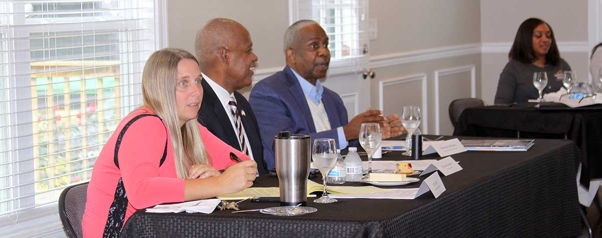 [Katie Miller of the HABG, HUD Kentucky Field Office Director Michael Browder, and HABG Executive Director Abraham Williams dialogue with partners on how best practices to help housing authority residents build self-sufficiency and resiliency]. HUD Photo