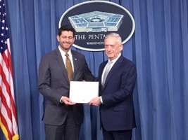 Defense Secretary James N. Mattis presents the citation for the Department of Defense Medal for Distinguished Public Service to House Speaker Paul Ryan in a Pentagon ceremony.