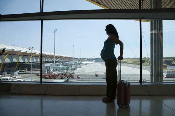 Pregnant woman in airport