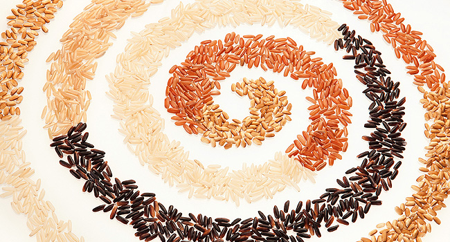 Swirls of colored rice bran: white, light brown, brown, red, and purple/black