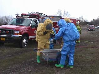 Pendleton, Oreg., March 16, 2002 -- Members of the Confederated Tribes of the Umatilla Indian Reservation Haz-Mat teams respond to a simulated tanker spill during the Comprehensive Haz-Mat Emergency Response Capability Assessment Program (CHERCAP) exercise. Photo by Mike Howard/ FEMA News Photo Photo by Mike Howard - Mar 15, 2002 - Location: Pendleton, OR 