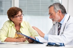 Photo of a woman asking her doctor a question
