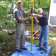 USGS scientists J. Alton Anderson and Carole D. Johnson prepare to collect a Nuclear Magnetic Resonance (NMR) log at a well. 