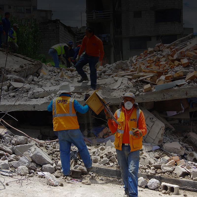 Workers search for earthquake survivors in rubble. 