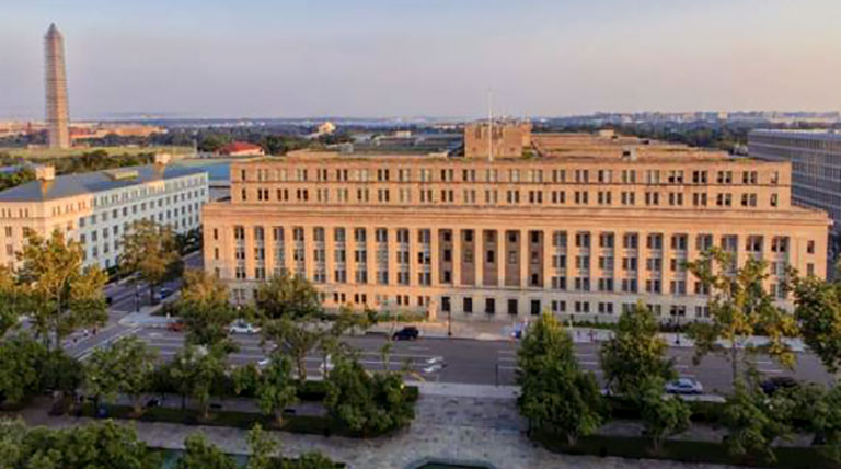 Department of Interior building exterior, with Washington Monument to the left in the distance