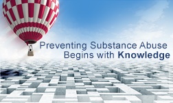 A red and white checkered hot-air balloon is rising up toward the right, above a complex maze below. A slogan to the right of the balloon says, “Preventing Substance Abuse Begins with Knowledge.”