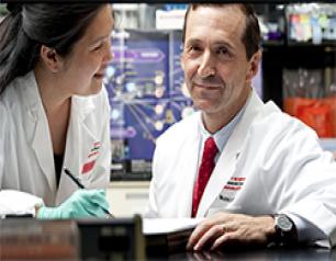John R. Mascola, M.D., right, led a team at the NIAID Vaccine Research Center that participated in this study.