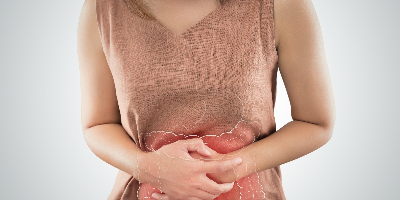 woman holding aching stomach