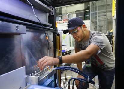 Tyler Cooksey, a graduate researcher at the University of Houston, uses ORNL’s Bio-SANS instrument at the High Flux Isotope Reactor to understand how micelles can be improved to create more effective drugs. (Image credit: ORNL/Genevieve Martin)