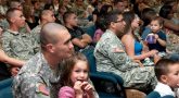 IMAGE: Soldiers attend a briefing with their families.