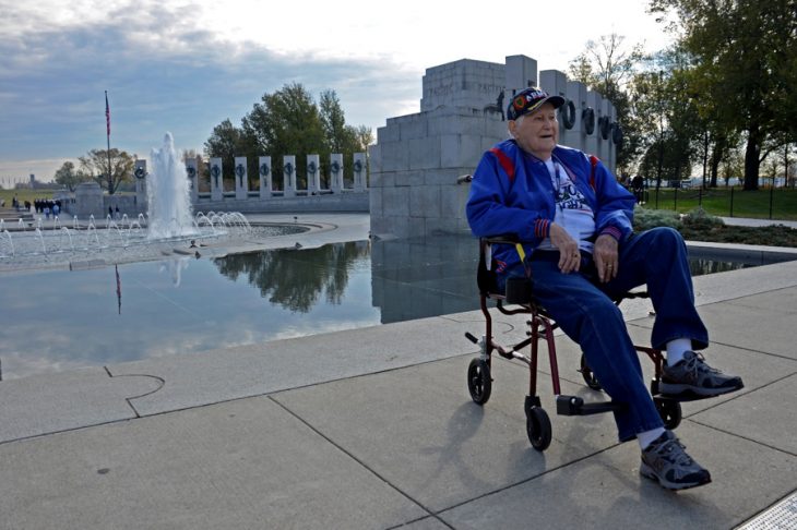 Man in wheelchair at WWII Monument