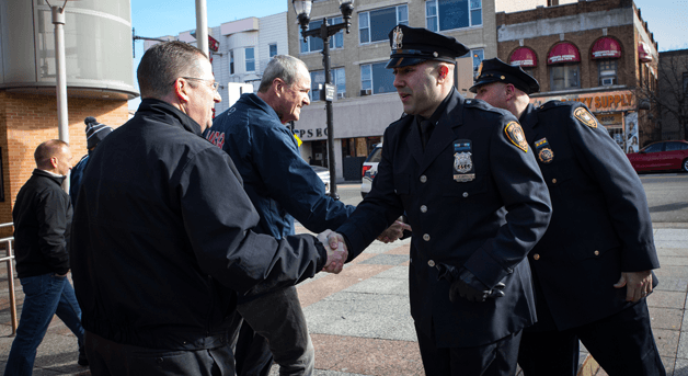 Photo: Phil Murphy shaking hands with officers