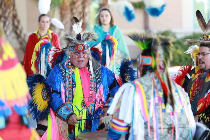 Members of the Lipan Apache Tribe of Texas perform a song from inside a drum circle during a special event held in observance of National Native American Heritage Month, which took place at the VA outpatient clinic in Harlingen, Texas, on November 16, 2018. (U.S. Department of Veterans Affairs photo by Reynaldo Leal)