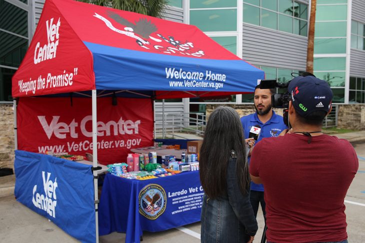 Local TV news station interviews Enrique Reyes about the drive thru and drop off event. Laredo Vet Center Photo taken during the Boots & Badges care package drive held October 26, 2018, at Vet Center in Laredo, Texas. The drive thru and drop off event collected a total of approximately 1,100 individual donated items for the  day. All donated items are being collected for care packages, which will then be sent to deployed service members from Laredo, Texas. (U.S. Department of Veterans Affairs photo by Luis H. Loza Gutierrez)