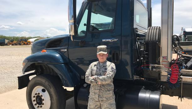 Soldier in front of truck