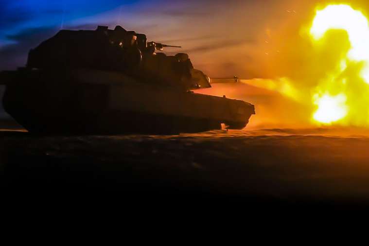 A tank fires at a target.