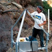 Rick LaHusen of the U.S. Geological Survey, shown with one of the “spider” units he developed for use on active volcanoes.