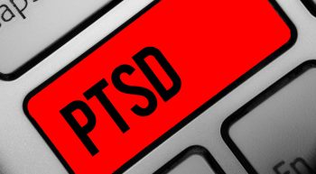 Laptop Keyboard with key "PTSD" highlighted