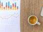 A mug of coffee and data charts