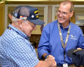 Image: Emerson Beach assists Veteran, Ron Keeler
