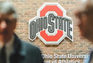 Image of attendees with the Ohio State logo in the background.