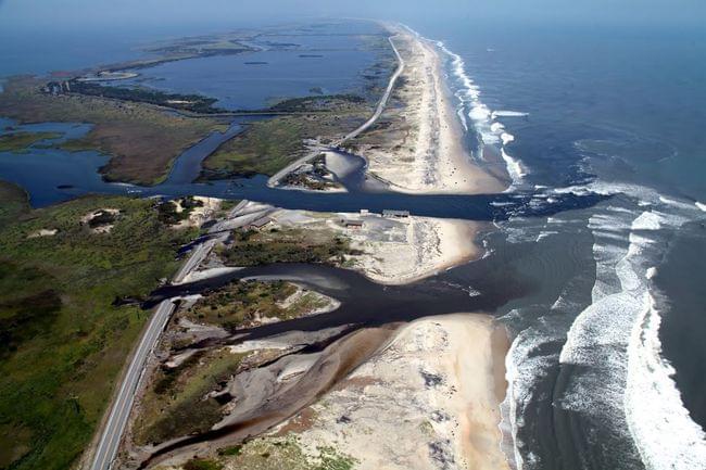 An aerial photograph showing four breaches with on inlet in NC 12 on Pea Island National Wildlife Refuge